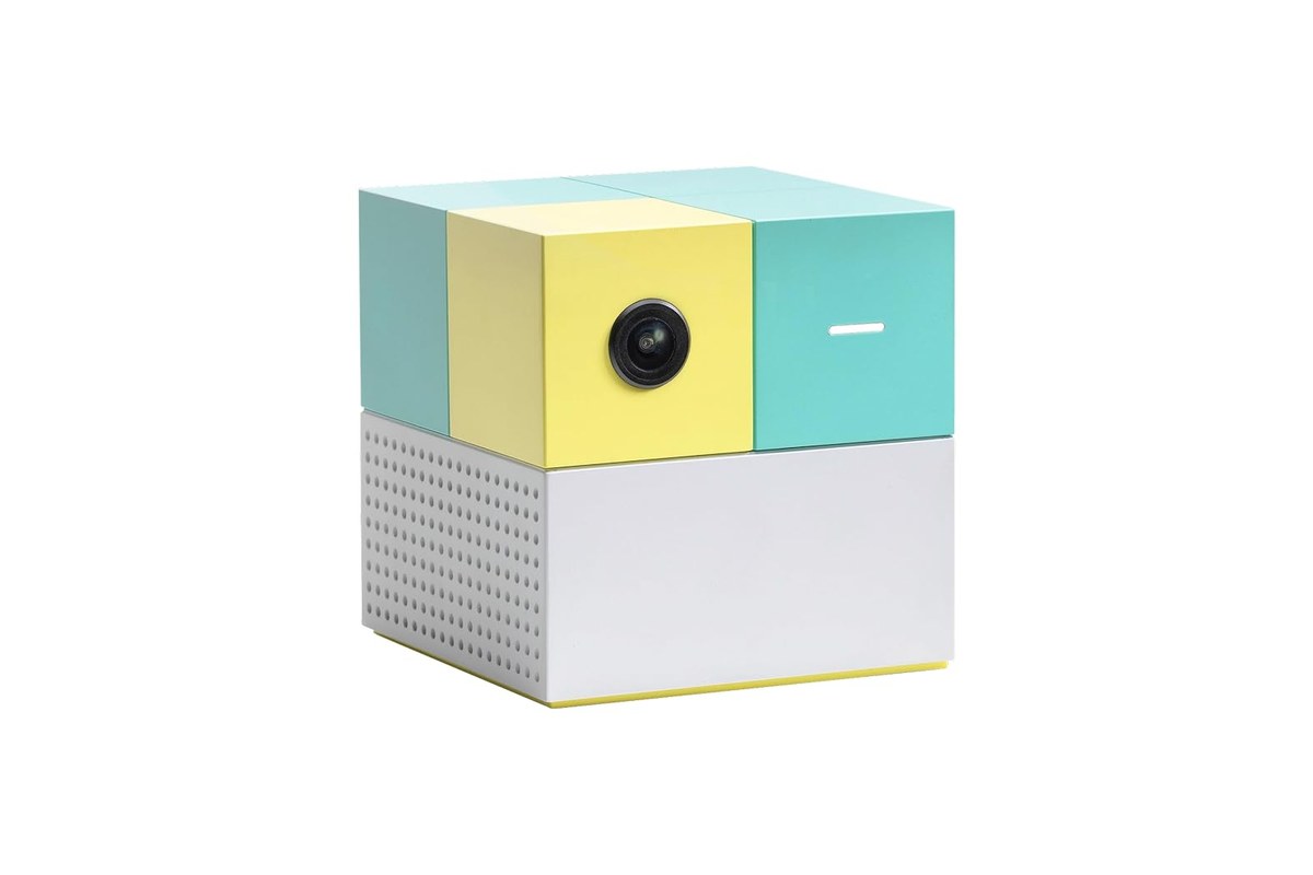 The Nex Playground console, a small white, yellow, and teal cube with a camera on the front, from the Amazon listing